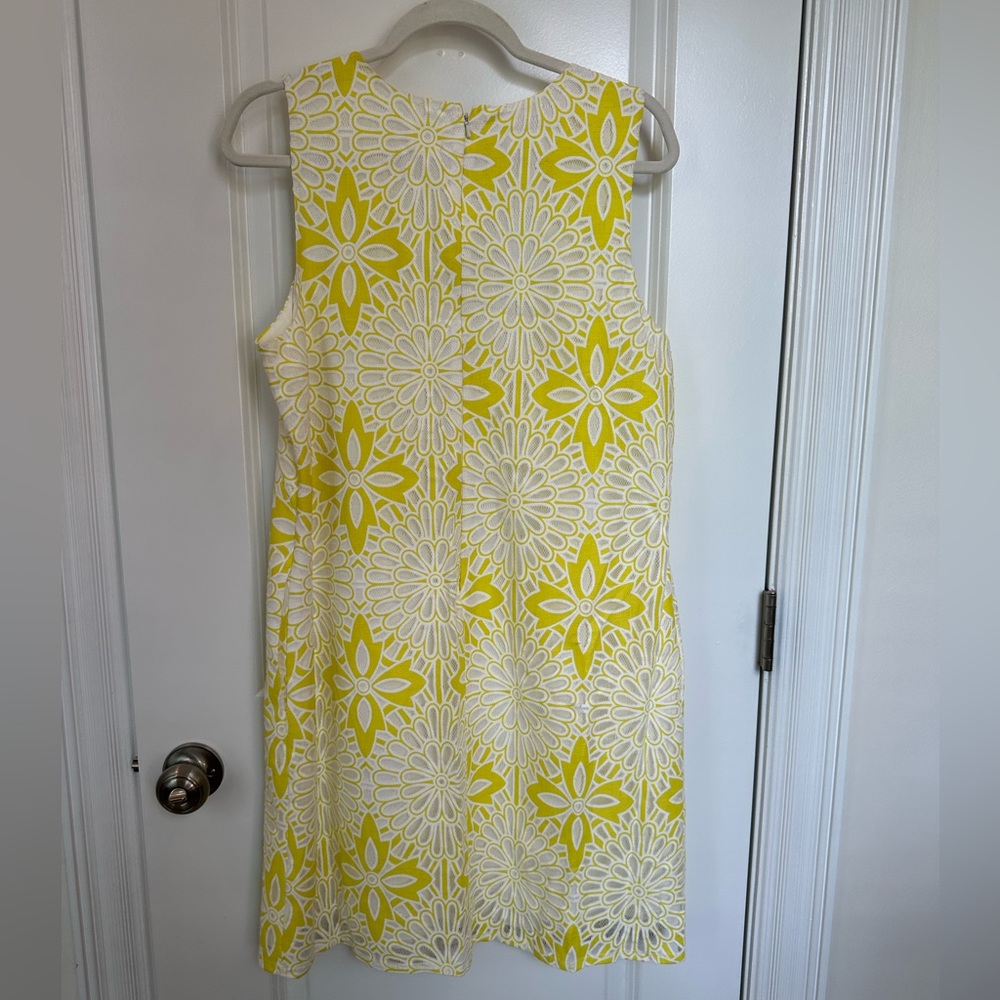 Yellow and white lacy floral shift dress.